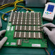Antminer D7 hashboard BXD34601 with BM1764 X11 ASIC chips and SGM2036 LDO chain on professional repair workbench — repair guide