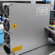 Bitmain APW12 PSU sub-variants (APW121215f, APW121417b, APW12A 277V) laid side-by-side on repair workbench