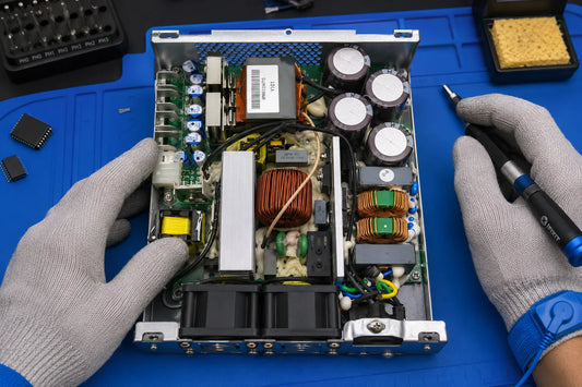 Bitmain APW8 PSU with PFC + flyback architecture and M6 copper-bar bolts on repair workbench — repair guide