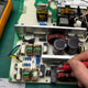 Opened APW12 power supply on repair bench showing internal components — PSU deep dive guide
