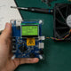 F1 ASIC Miner Fan Speed Tester (ZTW4101A) with Antminer + Whatsminer + Avalon fans on professional repair workbench — user manual & diagnostic guide