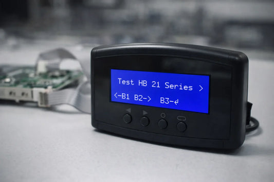 K3L multi-function hashboard tester displaying chip count results on a repair bench