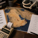 Shenzhen mining planning workspace with printed Middle East map showing UAE, Oman and Saudi Arabia coastal pins.