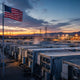 Bitcoin mining facility at dawn with American flag — weekly mining news roundup April 2026
