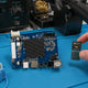 Whatsminer CB2 V8 H3 control board with Allwinner H3 CPU and DDR3 chips on repair workbench — repair guide