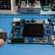 Whatsminer CB4 V10 H6 control board with Allwinner H6 CPU and DDR3 / NAND chips on repair workbench — repair guide