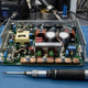 Whatsminer P21 PSU with copper busbars and M6 bolts on repair workbench with torque screwdriver — repair guide